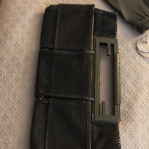 Small black patent leather and mesh clutch